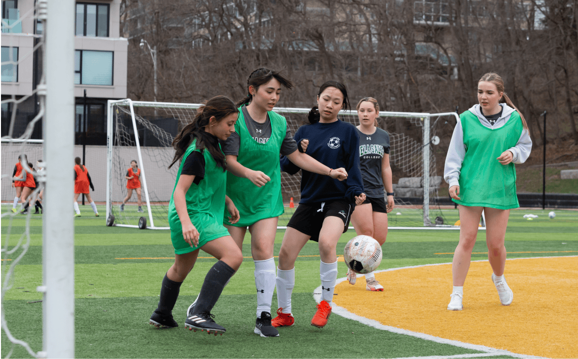 Students playing soccer